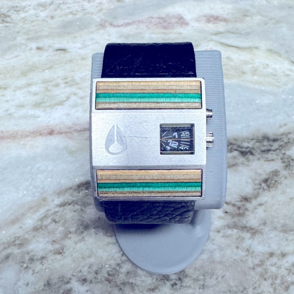 Nixon Rotolog. black leather “custom skateboard inlays”